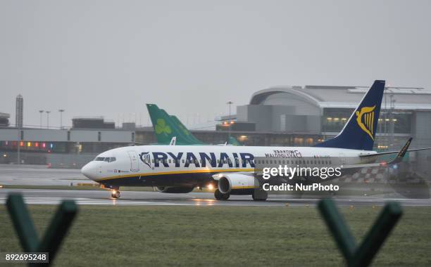 Ryanair plane is about to take off on the runway at Dublin airport. Passengers are facing severe travel disruption after Ryanair pilots in Ireland,...