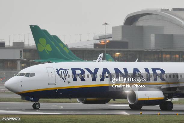 Ryanair plane is about to take off on the runway at Dublin airport. Passengers are facing severe travel disruption after Ryanair pilots in Ireland,...