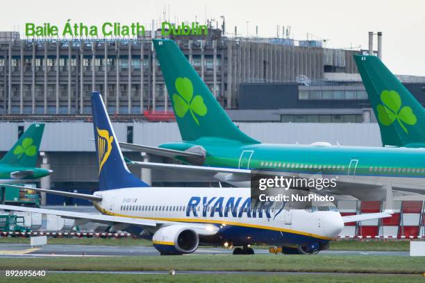 Ryanair plane on the runway at Dublin airport passes near Aer Lingus planes. Passengers are facing severe travel disruption after Ryanair pilots in...