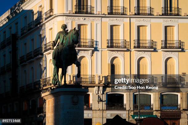 spanish cities - madrid - king charles iii monument. - puerta de sol stock-fotos und bilder
