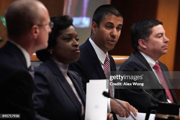 Federal Communications Commission Chairman Ajit Pai speaks as commission members Brendan Carr, Mignon Clyburn, Michael O'Rielly listen during a...