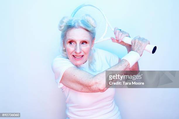 older woman with tennis racket