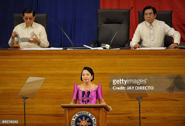 Philippine President Gloria Arroyo makes her annual state of the nation address before Congress, flanked by House Speaker Prospero Nograles and...