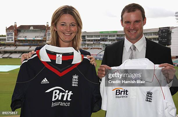 Charlotte Edwards captain of the England women's team and Andrew Strauss captain of England men's team hold shirts with the Brit Insurance logo...