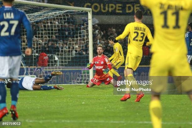 Edison Cavani of PSG celebrates after scoring a goal under the look of Strasbourg's French goalkeeper Alexandre Oukidja during the French League Cup...