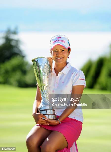 Ai Miyazato of Japan with the winners trophy after winning in a playoff against Sofie Gustafson of Sweden during the final round of the Evian Masters...