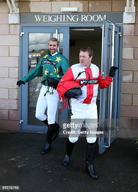 Phil Tufnell and Jason Gillespie prepare to race during the Betfair Stakes horse race as part of the Betfair Challenges at Warwick Racecourse on July...