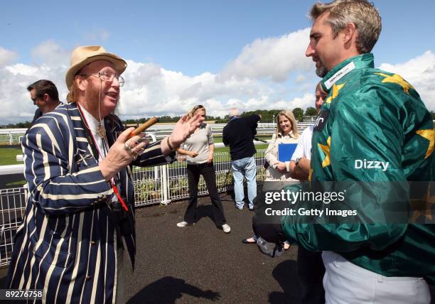 Jason Gillespie is joined by John McCririck as he prepares to race Phil Tufnell during the Betfair Stakes horse race, part of the Betfair Challenges...