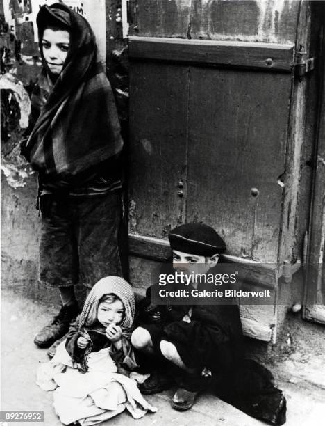 Children in the street in the Warsaw Ghetto, Poland, 1941.