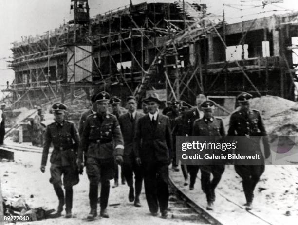 Reichsfuhrer-SS Heinrich Himmler carries out an inspection of the Monowitz-Buna plant at Auschwitz, Poland, 17th-18th July 1942. From left to right,...