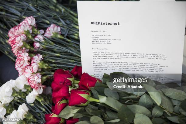 December 14: Protestors laid flowers and notes outside of the Federal Communications Commission headquarters after the FCC repealed the Obama era...
