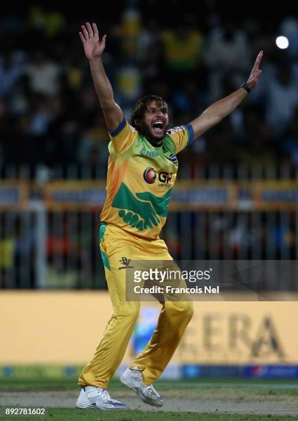 Shahid Afridi of Pakhtoons celebrate with team mates after taking a hat-trick during the T10 League match between Maratha Arabians and Pakhtoons at...