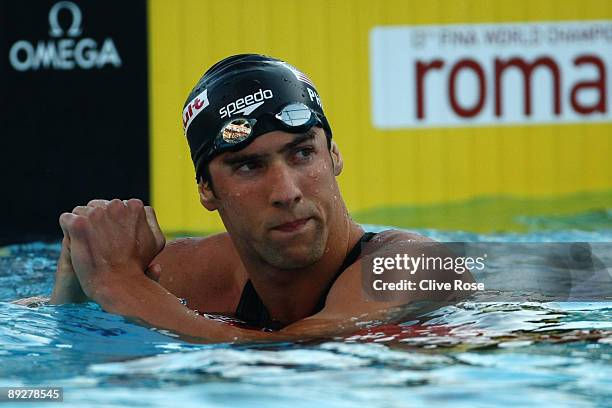 Michael Phelps of the United States looks at the scoreboard after coimng third in the Men's 200m Freestyle Semi-Final during the 13th FINA World...