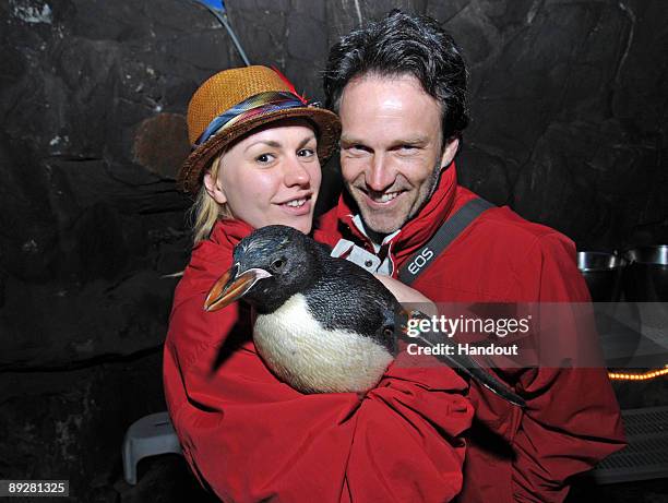 In this handout from SeaWorld San Diego, "True Blood" costars Anna Paquin and Stephen Moyer hold a macaroni penguin chick at SeaWorld San Diego's...