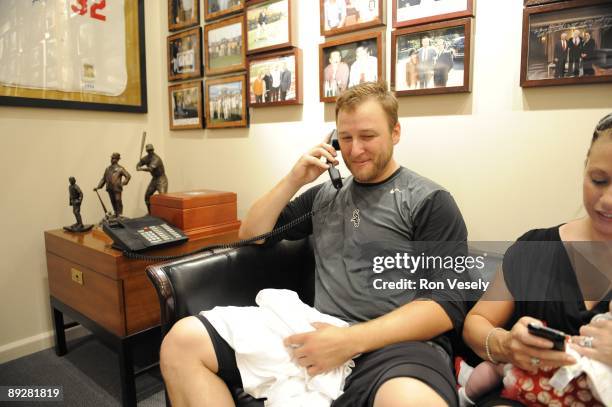 Mark Buehrle of the Chicago White Sox talks to President Barack Obama after recording the 18th perfect game in major league history against the Tampa...
