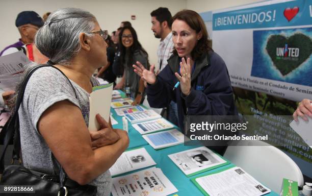 From left, Beatriz Rodriguez talks with Gloria "Gigi" Rivadeneyra, program manager for the Florida Department of Health, Seminole County, who set up...