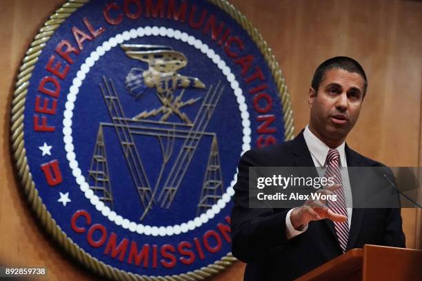 Federal Communications Commission Chairman Ajit Pai speaks to members of the media after a commission meeting December 14, 2017 in Washington, DC....