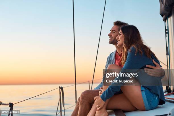 take to the seas for a life of ease - young couple sailing stock pictures, royalty-free photos & images