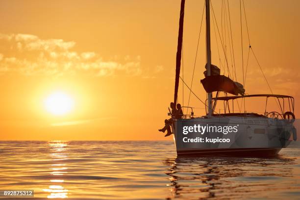 no better way to spend those summer days - yachting lifestyle stock pictures, royalty-free photos & images