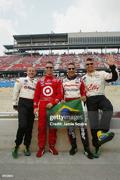 Brazilian drivers Cristiano da Matta, Bruno Junqueira, Tony Kanaan and Christian Fittipaldi display their support for their soccer World Cup winning...