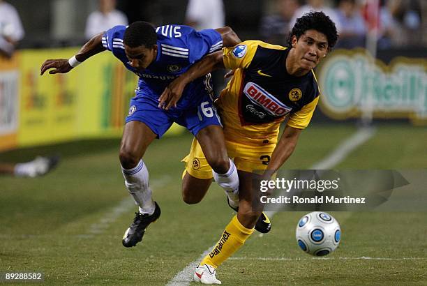 Scott Sinclair of Chelsea FC fights for possesion of the ball with Juan Carlos Silva of Club America during the World Football Challenge at Dallas...