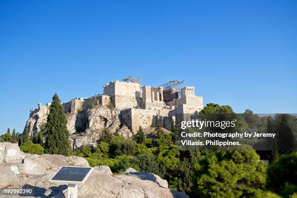 the acropolis of athens - ares god stockfoto's en -beelden