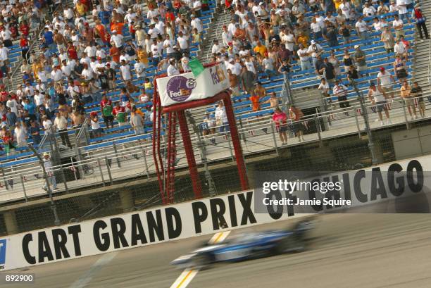 Dario Franchitti streaks across the start finish line during the Grand Prix of Chicago round 7 of the CART FedEx Championship Series on June 30th...