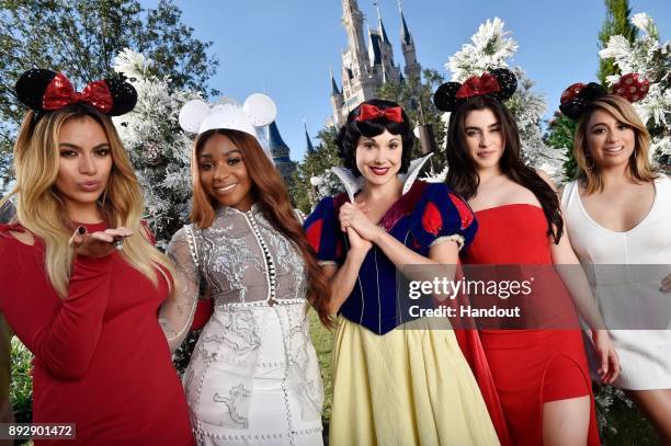 Multiplatinum-selling group Fifth Harmony poses with Snow White after singing "Can You See" at Magic Kingdom Park in Lake Buena Vista, Fla., November...