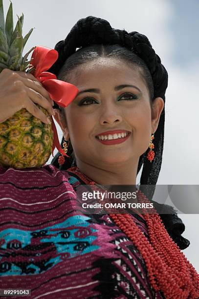 Dancer from Santa Maria Asuncion Tlaxiaco performs during the Guelaguetza celebration on July 27, 2009 in Oaxaca, Mexico. The Guelaguetza is a...