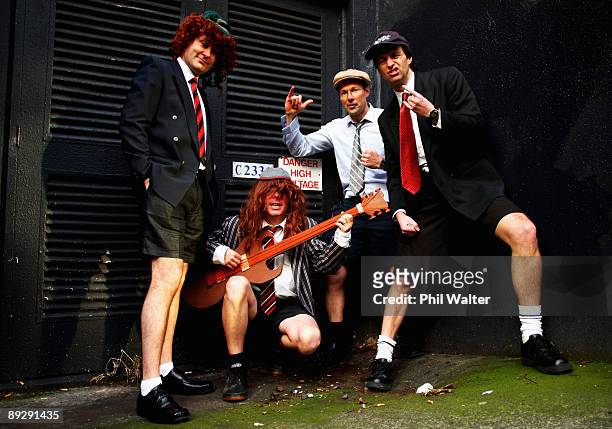 Fans Mathew Covacich, Charles Churton, Michael Cato and Dean Laurie pose as they wait in line outside Real Groovy Records to buy tickets for AC/DC's...