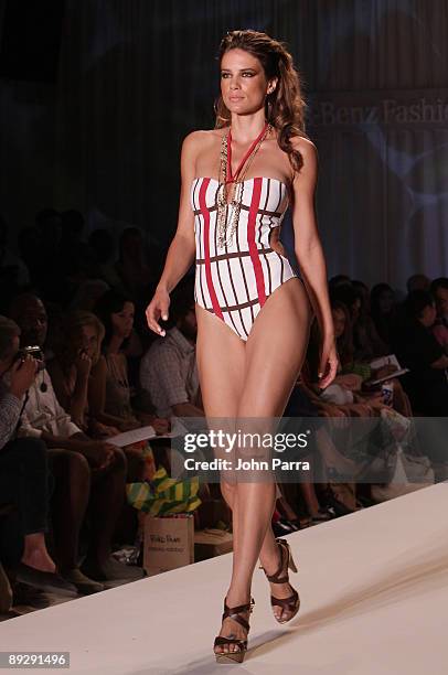 Model walks the runway at the Poko Pano 2010 fashion show during Mercedes-Benz Fashion Week Swim at The Oasis on July 18, 2009 in Miami, Florida.