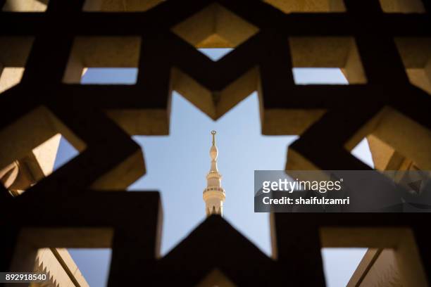 view of minaret in mosque al-nabawi of medina. - arabic calligraphy stock pictures, royalty-free photos & images