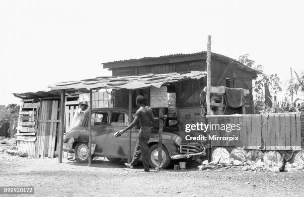 Morris Oxford undergoing repairs at a auto repair garage off the Spanish Town Road, Kingston, Jamaica/ 19th May 1963.