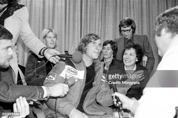 James Hunt, the new World Motor Racing Champion, received a hero's welcome when he flew into Heathrow Airport this morning from Japan. The...