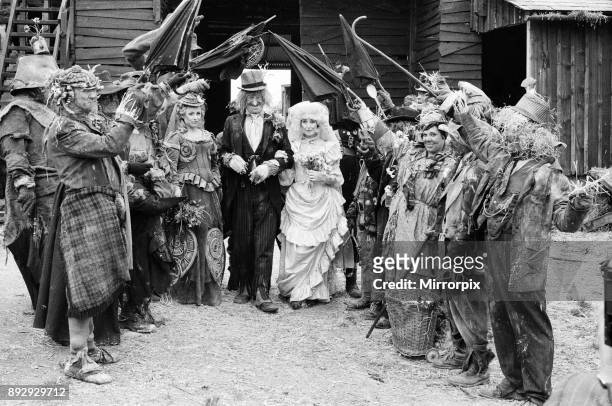 Television character Worzel Gummidge who is played by Jon Pertwee marries his Aunt Sally, played by Una Stubbs, in a barn at Braishfield, near...