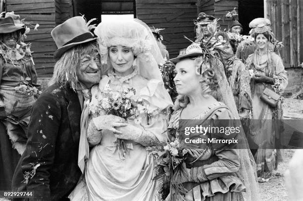 Television character Worzel Gummidge who is played by Jon Pertwee marries his Aunt Sally, played by Una Stubbs, in a barn at Braishfield, near...