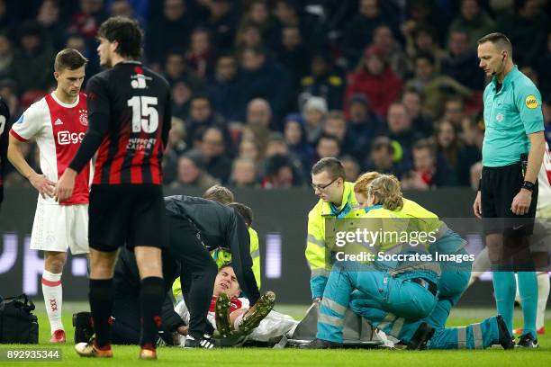 Maximilian Wober of Ajax is leaving the pitch injured during the Dutch Eredivisie match between Ajax v Excelsior at the Johan Cruijff Arena on...