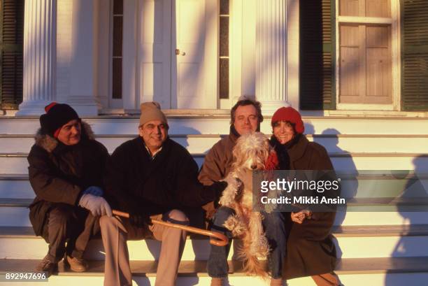 Director James Ivory, Producer Ismail Merchant, composer Richard Robbins, and photographer Mikki Ansin sit on the steps of the big house in...