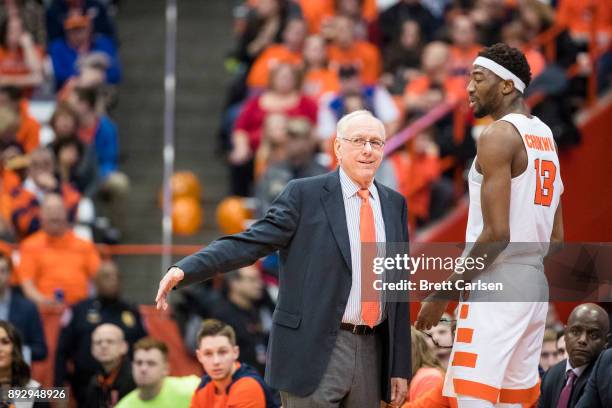 Head coach Jim Boeheim of the Syracuse Orange speaks with Paschal Chukwu during the first half against the Colgate Raiders at the Carrier Dome on...