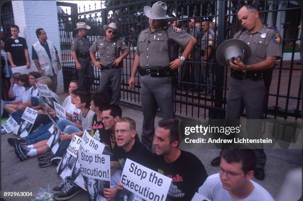 Tennessee Colony, TX - CIRCA 1990's: Texas state troopers prepare to arrest demonstrators protesters blocking the entrance to the Governor's mansion...