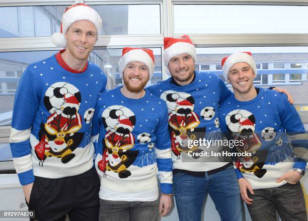 Sunderland players Robin Ruiter, Jonny Williams, Lee Cattermole and George Honeyman wear Christmas jumpers during a Christmas visit to Sunderland...