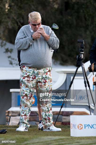 John Daly waits to tee off on the 10th tee during the first round of the PNC Father/Son Challenge at The Ritz-Carlton Golf Club on December 14, 2017...