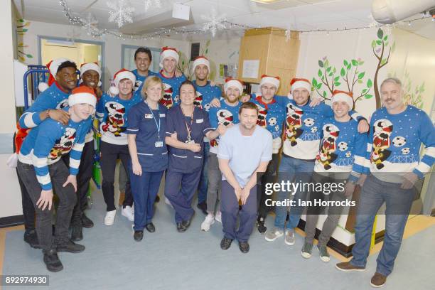 Sunderland manager Chris Coleman and his players meet staff during a Christmas visit to Sunderland Royal Infirmary on December 14, 2017 in...