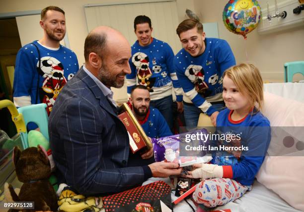 Pheobe Dodds 5 of Consett is presented with Christmas gifts by the Sunderland squad and chief executive Martin Bain at Durham University Hospital on...