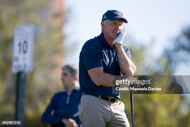 Greg Norman waits to hit a tee shot on the 10th tee during the first round of the PNC Father/Son Challenge at The Ritz-Carlton Golf Club on December...