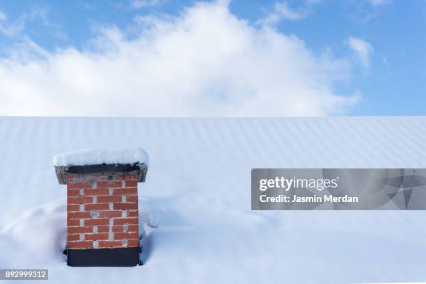 chimney roof house under winter snow - chimney stock pictures, royalty-free photos & images