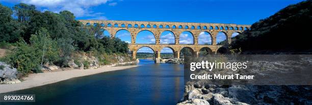 ancient roman aqueduct of pont du gard - pont du gard ストックフォトと画像