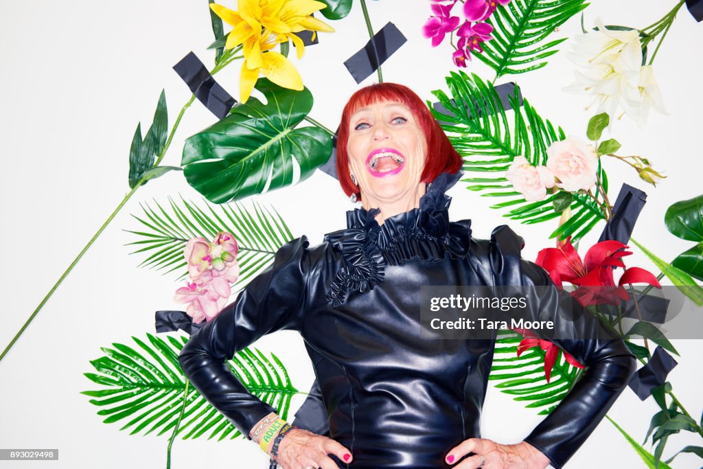 Older woman laughing in couture clothing