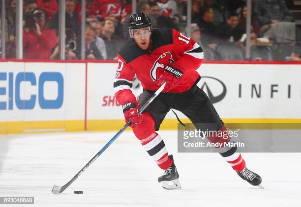 Jimmy Hayes of the New Jersey Devils plays the puck against the Los Angeles Kings during the game at Prudential Center on December 12, 2017 in...
