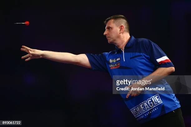 Krzysztof Ratajski of Poland in action during his first round match against James Wilson of England during day one of the 2018 William Hill PDC World...